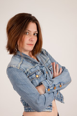 woman in blue jean jacket with arms crossed