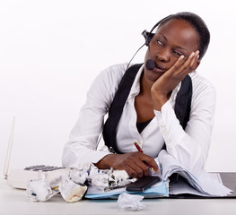 Young South African woman overwhelmed by work