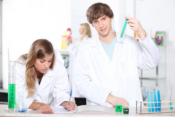 Students in a chemistry class with test tubes