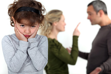cute little girl distressed over parents' quarrel