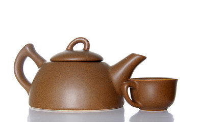 teapot and teacup over white