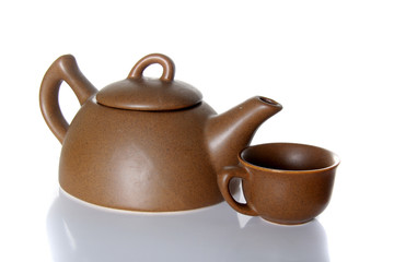 teapot and teacup over white