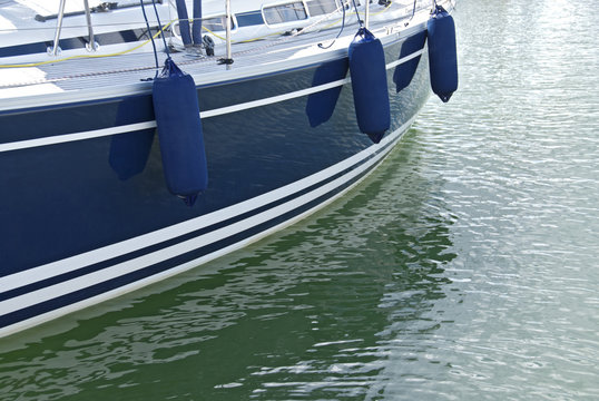 Blue motorboat on calm water