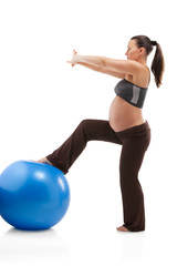 Fototapeta na wymiar Pregnant woman doing exercises with gim ball, isolated on white