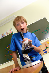 Boy with microscope