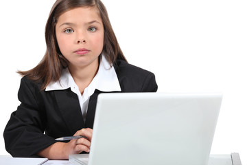 Little girl dressed as business worker