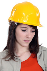 A sad female construction worker.