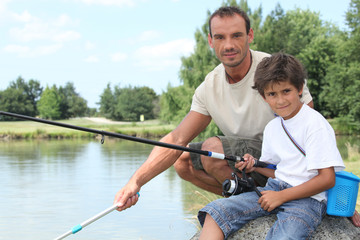 Father and son on a fishing trip at a lake