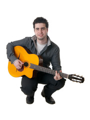 The musician plays an acoustic guitar