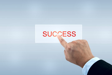 Businessman hand pushing SUCCESS button