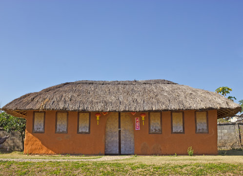 House made ​​of clay at Santichon village in Pai, Mae Hong S
