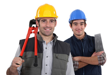 craftsman and apprentice posing together
