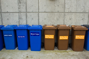 Row of Recycling and Garbage Cans