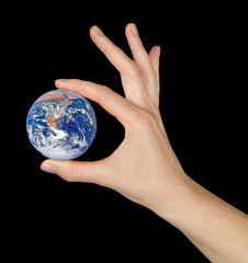 Planet earth on palms.Elements of this image furnished by NASA