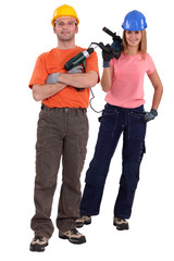 Man and woman with power drills