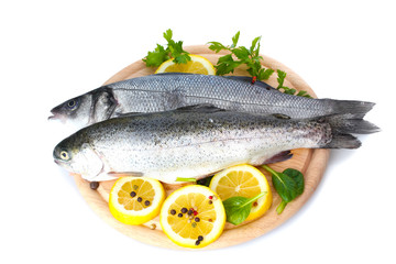 Fresh fishes with lemon, parsley and spice