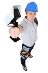 Electrician holding security camera