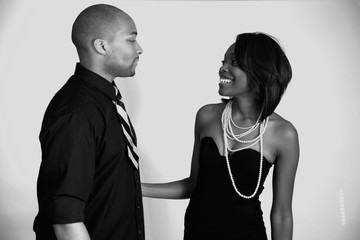 Black couple smiling and touching each other