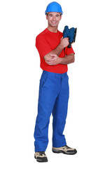 portrait of craftsman holding sander machine