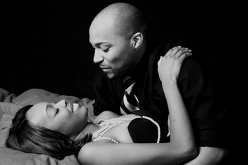 Romantic black couple, reclining  together