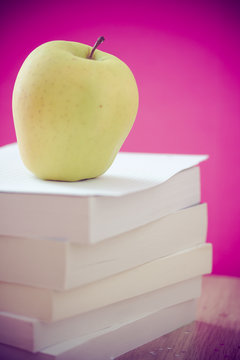 back to school essentials: books and healthy apple