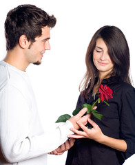 Young couple with rose, isolated