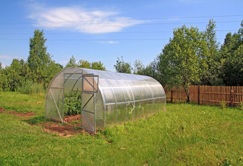 plastic hothouse in rural vegetable garden