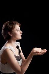 Obraz premium Pretty woman looking left with her hands up