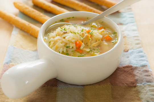 Chicken rice soup with bread stick