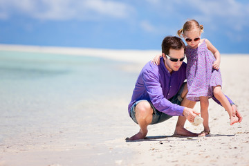 Father and daughter on beach