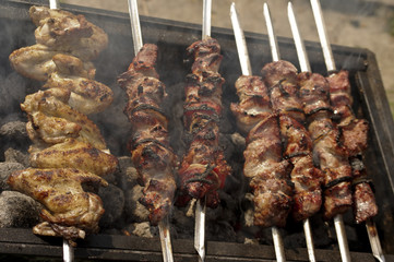 Chicken shashlik in preparation at barbecue