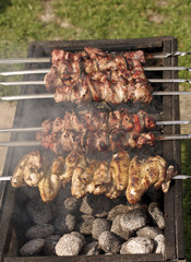 Chicken shashlik in preparation at barbecue