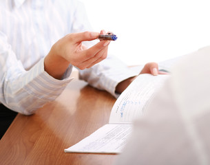 Person signing important document isolated