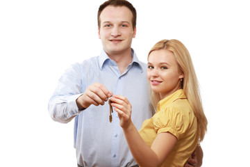 Closeup of a young couple with keys