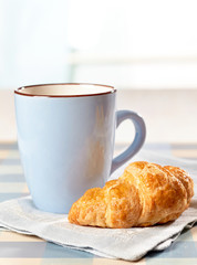 croissant and tea cup