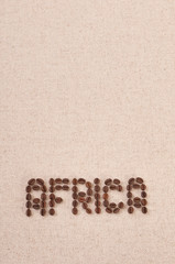 The word Africa written with coffee beans on canvas