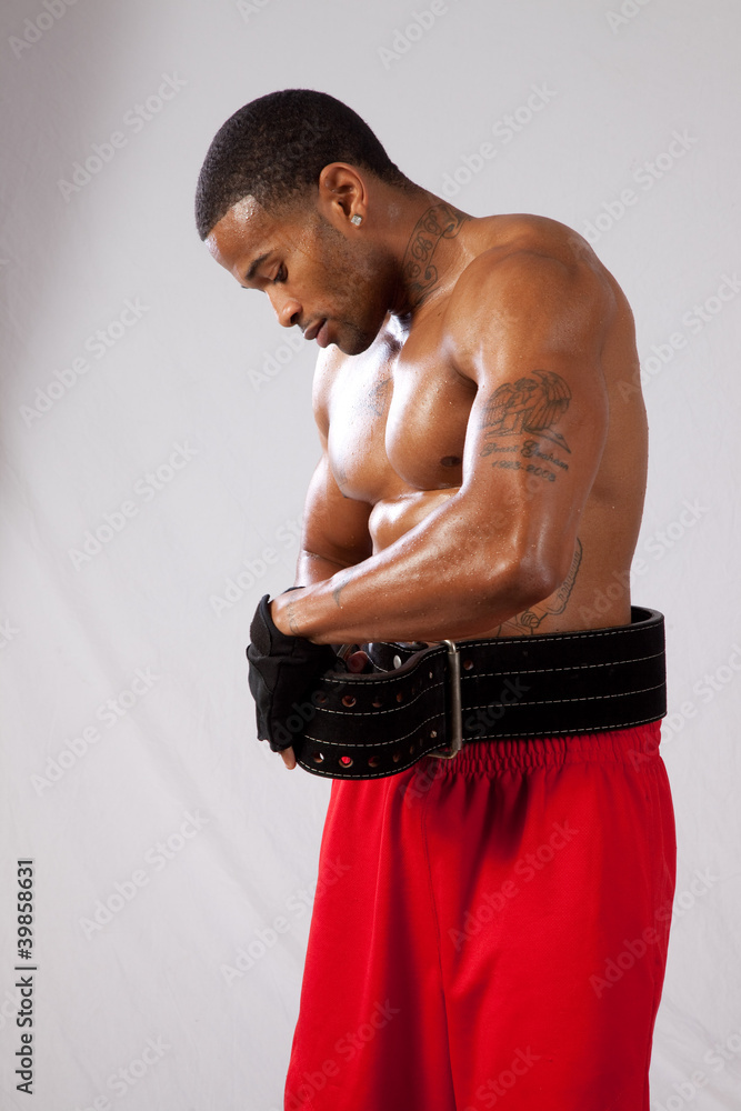 Wall mural muscular black man working out