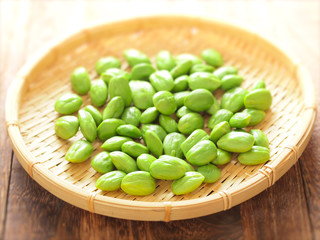 close up of a basket of petai beans