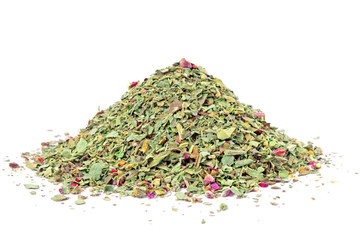 Pile of ground dried Basil (Sweet Basil) isolated on white