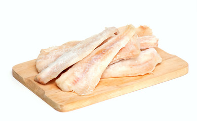frozen pollock (pallock) on cutting board isolated
