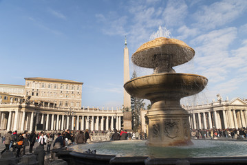 Fototapeta na wymiar Fountain in St Peters Square in Rome Italy