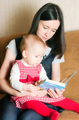 Mother reading to daughter