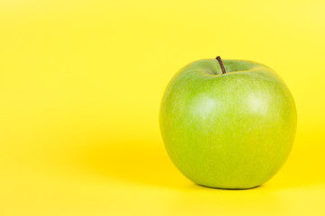 Apple on a yellow background.