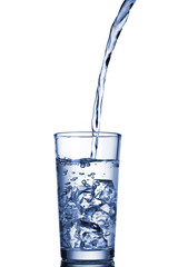 water pouring into glass isolated on white