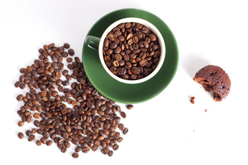 Cup of coffee beans and a piece of cake