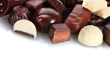 Many different chocolate candy isolated on white
