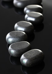 Spa stones on grey background