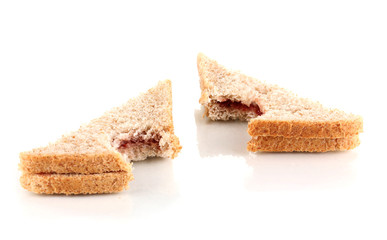 Bitten sandwiches with jam isolated on white