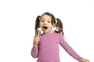 portrait of little girl with a lollipop on white background © alexandre zveiger