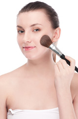 Beautiful woman with make up brush